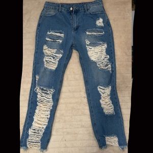 Jeans from shein holes in the front and back very cute no stretch tho
